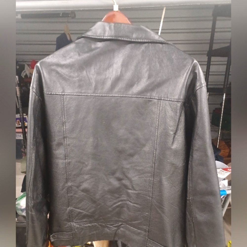 One jacket that appears to be leather. XXL in size black in color.